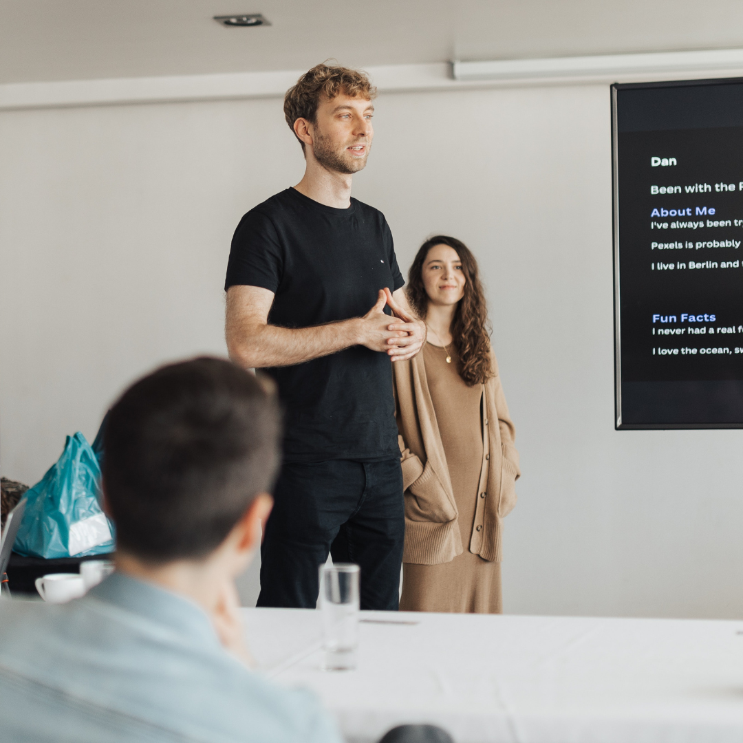 GenTwo team members presenting during an internal session